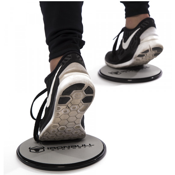 Iron Bull Power Gliderz under athletic shoes during a sliding lunge exercise